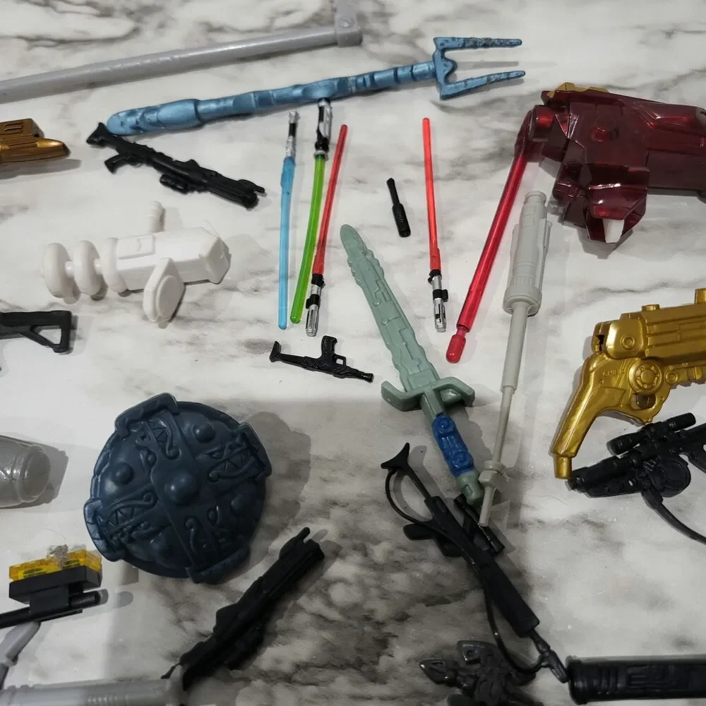 Assorted action figure weapons